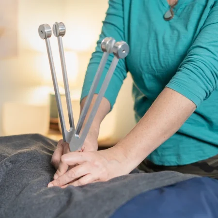 Tuning forks used for vibration therapy